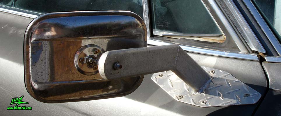 Photo of a 63 Cadillac Sedan deVille that was custom lifted & turned into a 4 Wheel Drive Off Road 4x4 Car. Passenger Side Mirror of a lifted 63 Caddy 4x4 Car