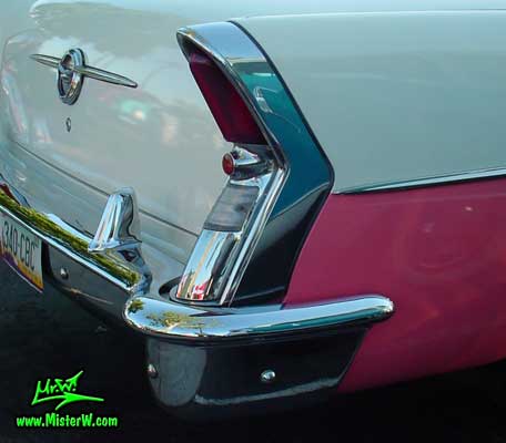 Photo of a white & pink 1956 Buick 2 Door Hardtop Coupe at the Scottsdale Pavilions Classic Car Show in Arizona. 1956 Buick Fin
