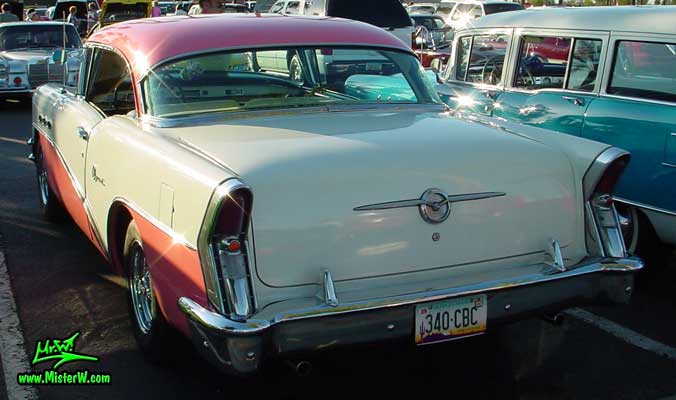 Photo of a white & pink 1956 Buick 2 Door Hardtop Coupe at the Scottsdale Pavilions Classic Car Show in Arizona. 1956 Buick Rearview