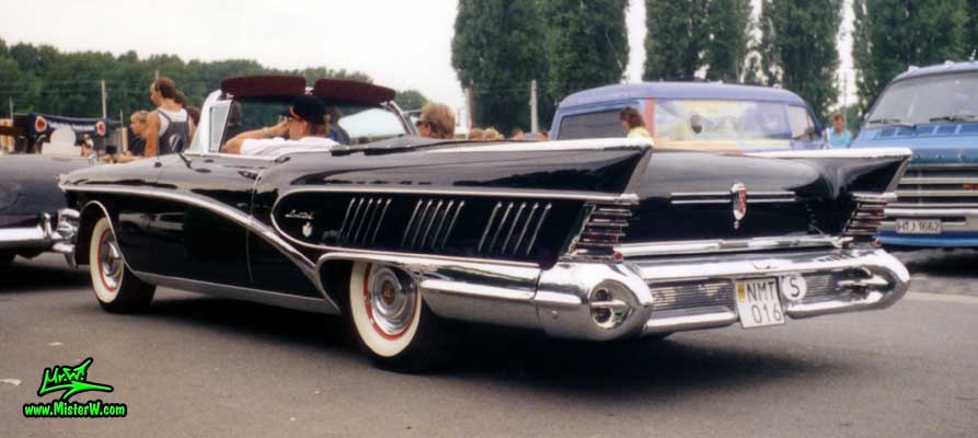 Photo of a black 1958 Buick Limited Convertible at a classic car meeting in Germany. 1958 Buick Limited Convertible Tail Fins