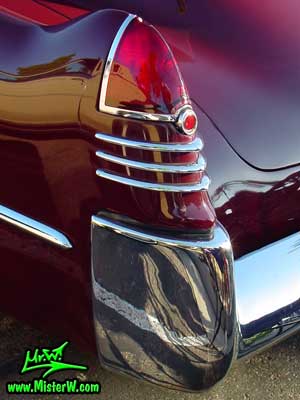 Photo of a maroon 1948 Cadillac Series 62 Sedanet 2 door fastback coupe at the Scottsdale Pavilions Classic Car Show in Arizona. 1948 Cadillac Tail Fin