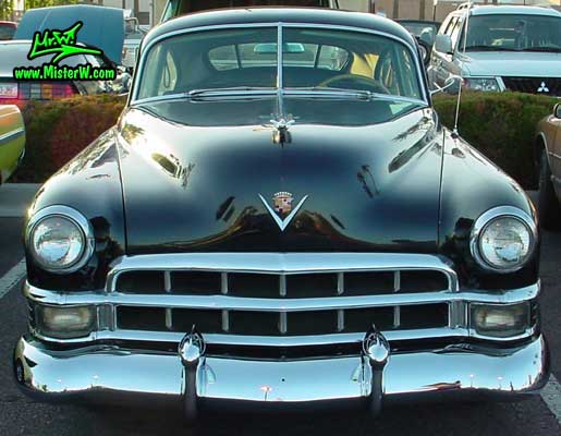 Photo of a black 1949 Cadillac Series 61 Sedanet 2 door fastback coupe at the Scottsdale Pavilions Classic Car Show in Arizona. 1949 Cadillac Series 61 Sedanet fastback coupe