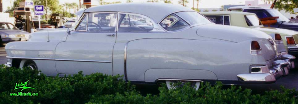 Photo of a white 1951 Cadillac Series 62 Coupe 2 Door Hardtop at the Scottsdale Pavilions Classic Car Show in Arizona. White 1951 Cadillac