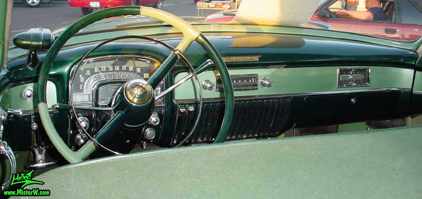 Photo of the dashboard of a turquoise 1953 Cadillac Series 62 Sedan 4 Door Hardtop at a classic car meeting in Phoenix, Arizona. 1953 Cadillac Dashboard