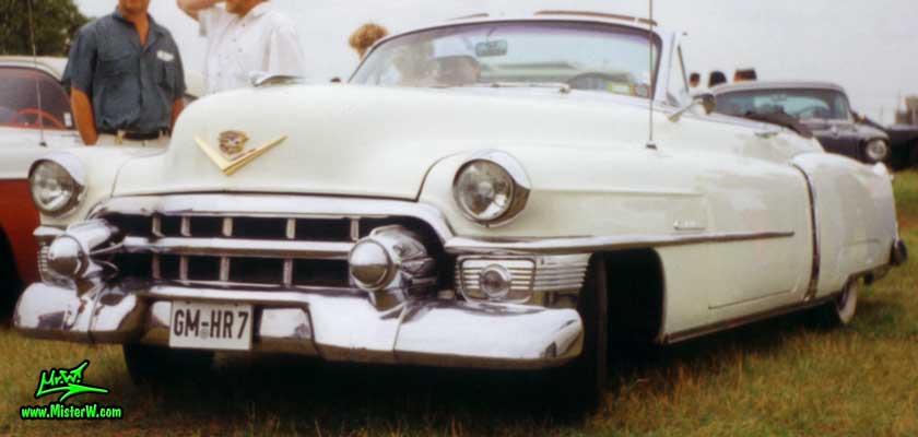 Photo of a white 1953 Cadillac Series 62 Convertible at a classic car meeting in Germany. 1953 Cadillac Series 62 Convertible