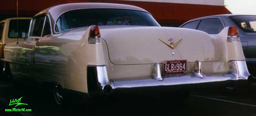 Photo of a cream colored 1954 Cadillac Series 62 Coupe 2 Door Hardtop in Scottsdale, Arizona. 1954 Caddy Tail Fins