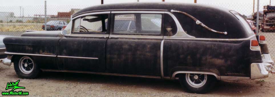 Photo of a black 1954 Cadillac Series 86 Commercial Chassis Hearse at a junk yard in Phoenix, Arizona. Black 1954 Cadillac Hearse
