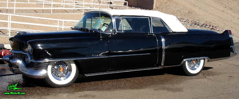 Photo of a black 1954 Cadillac Convertible at a classic car auction in Scottsdale, Arizona. Sideview of a 1954 Cadillac Convertible