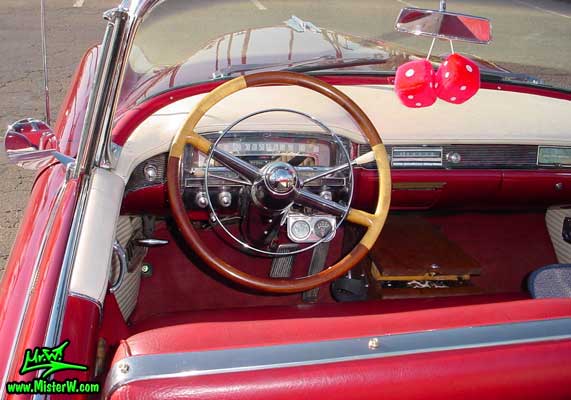 Photo of a red 1954 Cadillac Eldorado Convertible at the Scottsdale Pavilions Classic Car Show in Arizona. 1954 Cadillac Eldorado Odometer & Steering Wheel