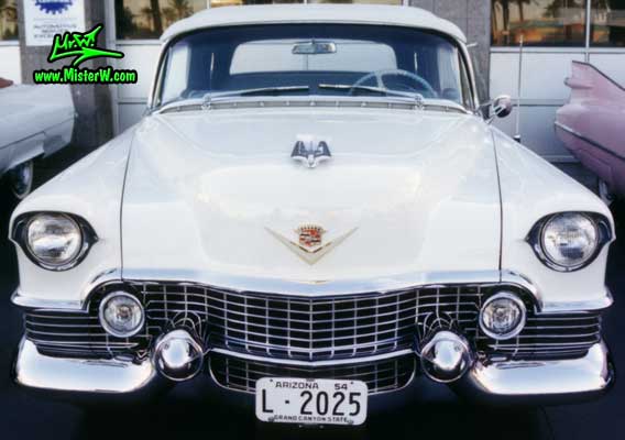 Photo of a white 1954 Cadillac Eldorado Convertible at the Scottsdale Pavilions Classic Car Show in Arizona. White 1954 Caddy Eldorado Convertible Front Grill