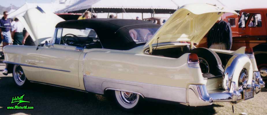 Photo of a white 1954 Cadillac Eldorado Convertible at a classic car auction in Scottsdale, Arizona. White 1954 Cadillac Eldorado Convertible with a Black Top and a Continental Kit