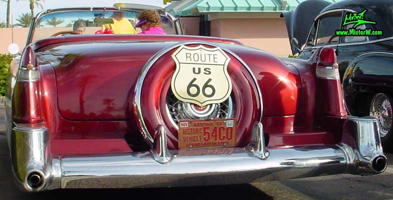 Photo of a red 1954 Cadillac Eldorado Convertible at the Scottsdale Pavilions Classic Car Show in Arizona. 1954 Caddy Eldorado with Continental Kit