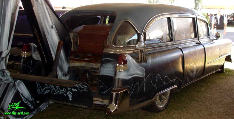 Photo of a black 1954 Cadillac Monster Garage Hearse at a classic car auction in Scottsdale, Arizona. Sideview of a 54 Caddy Hearse