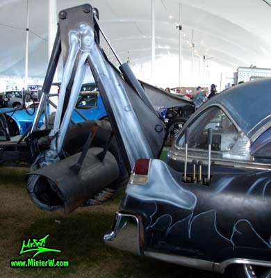 Photo of a black 1954 Cadillac Monster Garage Hearse at a classic car auction in Scottsdale, Arizona. 54 Cadillac Hearse with a Hydraulic Backhoe