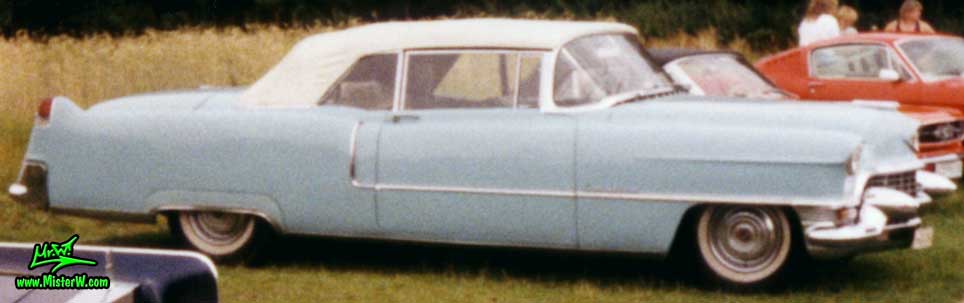 Photo of a turquoise 1955 Cadillac Series 62 Convertible at a classic car meeting in K�ln Chorweiler (Cologne), Germany. Torquoise 1955 Cadillac Convertible with closed white top