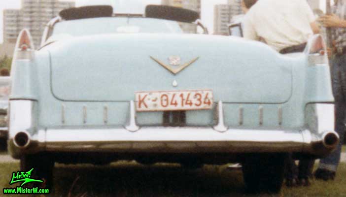 Photo of a turquoise 1955 Cadillac Series 62 Convertible at a classic car meeting in K�ln Chorweiler (Cologne), Germany. 1955 Cadillac Convertible Rear Fins