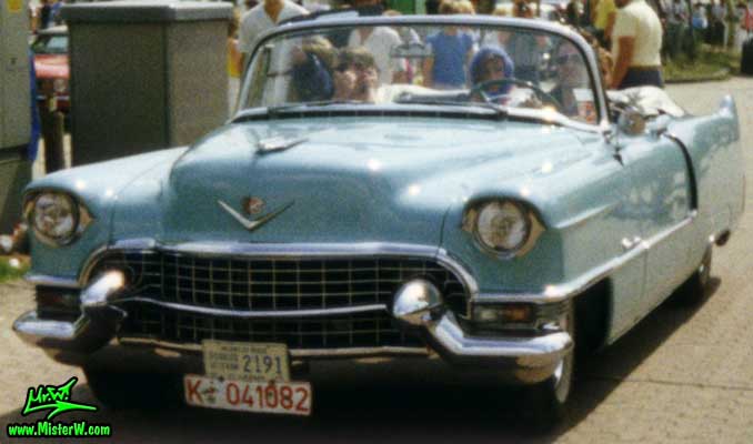 Photo of a turquoise 1955 Cadillac Series 62 Convertible at a classic car meeting in K�ln Chorweiler (Cologne), Germany. Turquoise 1955 Cadillac Convertible ariving at a classic car meeting in K�ln Chorweiler