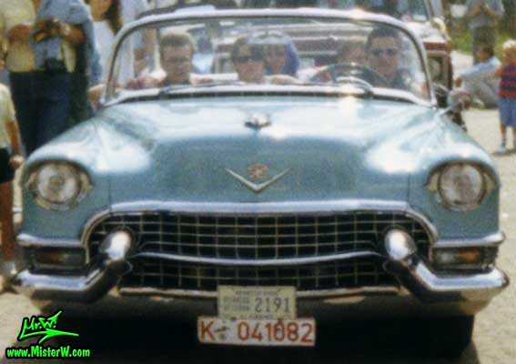 Photo of a turquoise 1955 Cadillac Series 62 Convertible at a classic car meeting in K�ln Chorweiler (Cologne), Germany. Turquoise 1955 Cadillac Convertible ariving at a classic car meeting in Cologne, Germany