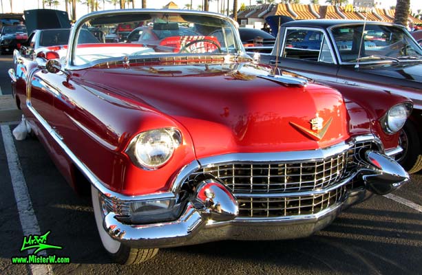 Photo of a red 1955 Cadillac Eldorado Convertible at the Scottsdale Pavilions Classic Car Show in Arizona. 55 Eldorado