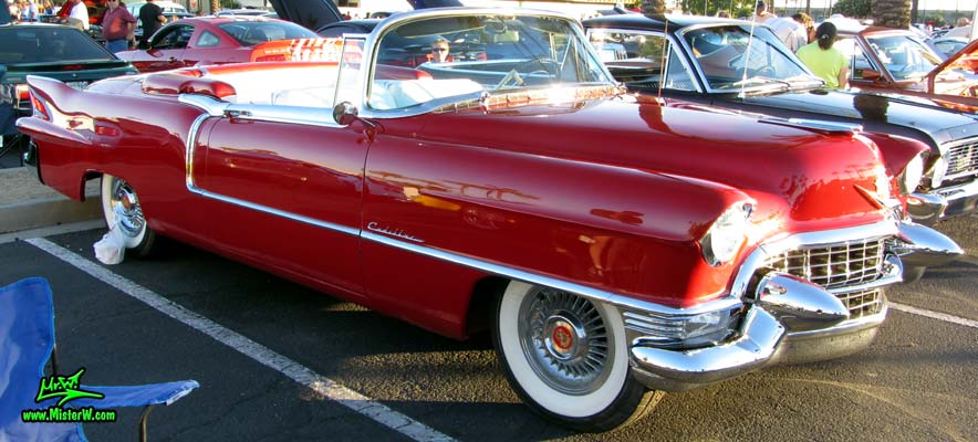 Photo of a red 1955 Cadillac Eldorado Convertible at the Scottsdale Pavilions Classic Car Show in Arizona. Sideview of a 1955 Cadillac Eldorado Convertible