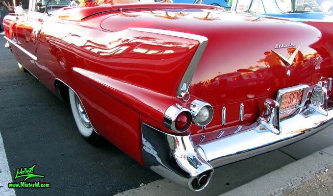Photo of a red 1955 Cadillac Eldorado Convertible at the Scottsdale Pavilions Classic Car Show in Arizona. Tail Fin of a 1955 Cadillac Eldorado Convertible