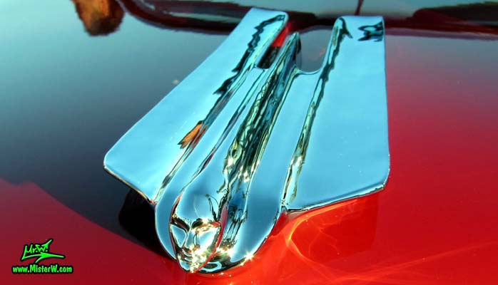 Photo of a red 1955 Cadillac Eldorado Convertible at the Scottsdale Pavilions Classic Car Show in Arizona. Hood Ornament of a 1955 Cadillac Eldorado Convertible