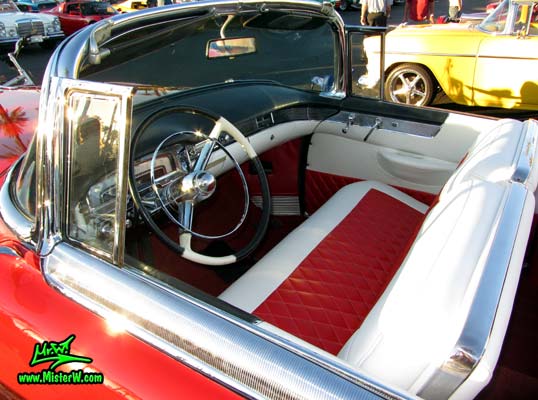 Photo of a red 1955 Cadillac Eldorado Convertible at the Scottsdale Pavilions Classic Car Show in Arizona. Dash & Interior of a 55 Cadillac Eldorado Convertible