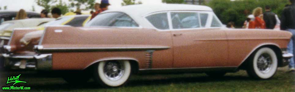 Photo of a pink 1957 Cadillac Coupe 2 Door Hardtop at a classic car meeting in K�ln Chorweiler (Cologne), Germany. 1957 Cadillac Coupe in Germany