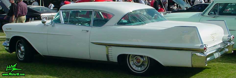 Photo of a white 1957 Cadillac Coupe 2 Door Hardtop at a classic car auction in Scottsdale, Arizona. 1957 Cadillac Coupe 4 Sale