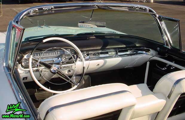 Photo of a white 1957 Cadillac Series 62 Convertible at the Scottsdale Pavilions Classic Car Show in Arizona. 1957 Cadillac Interior & Dash Board