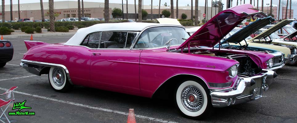 Photo of a purple violet 1957 Cadillac Eldorado Biarritz Convertible at the Scottsdale Pavilions Classic Car Show in Arizona. Frontview of a 1957 Cadillac Eldorado Biarritz Convertible