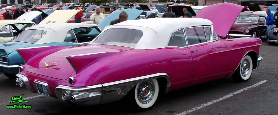 Photo of a purple violet 1957 Cadillac Eldorado Biarritz Convertible at the Scottsdale Pavilions Classic Car Show in Arizona. Sideview of a 1957 Cadillac Eldorado Biarritz Convertible