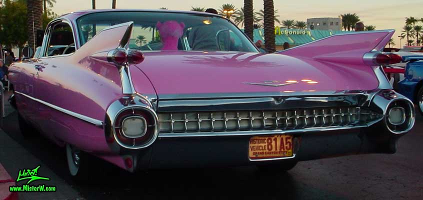 Photo of a pink 1959 Cadillac 2 Door Hardtop Coupe at the Scottsdale Pavilions Classic Car Show in Arizona. 1959 Cadillac Tail Fins