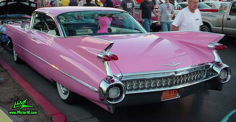 Photo of a pink 1959 Cadillac 2 Door Hardtop Coupe at the Scottsdale Pavilions Classic Car Show in Arizona. 1959 Caddy