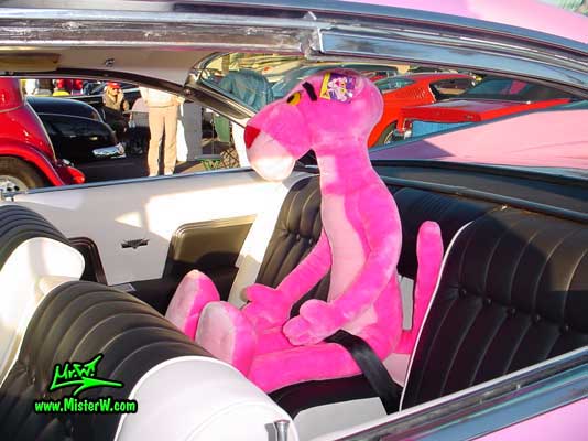 Photo of a pink 1959 Cadillac 2 Door Hardtop Coupe at the Scottsdale Pavilions Classic Car Show in Arizona. Pink Panther in a pink 1959 Cadillac