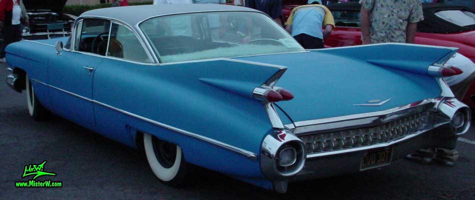 Photo of a blue 1959 Cadillac 2 Door Hardtop Coupe at the Scottsdale Pavilions Classic Car Show in Arizona. Tail Fins of a blue 1959 Cadillac