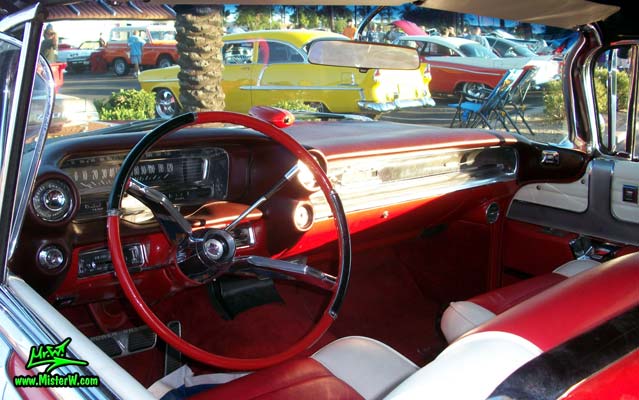 Photo of a red 1959 Cadillac Eldorado Biarritz Convertible at the Scottsdale Pavilions Classic Car Show in Arizona. Dashboard of a 1959 Cadillac Eldorado Biarritz Convertible