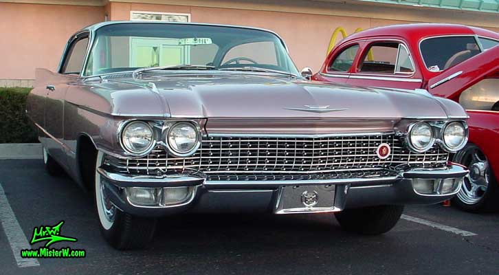 Photo of a pink 1960 Cadillac 2 Door Hardtop Coupe at the Scottsdale Pavilions Classic Car Show in Arizona. 1960 Cadillac