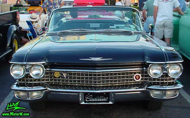 Photo of a black 1960 Cadillac Convertible at the Scottsdale Pavilions Classic Car Show in Arizona. 1960 Cadillac Chrome Grill