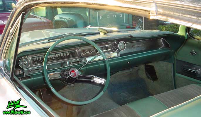 Photo of a white 1961 Cadillac 2 Door Hardtop Coupe at the Scottsdale Pavilions Classic Car Show in Arizona. 1961 Cadillac Interior & Dash Board