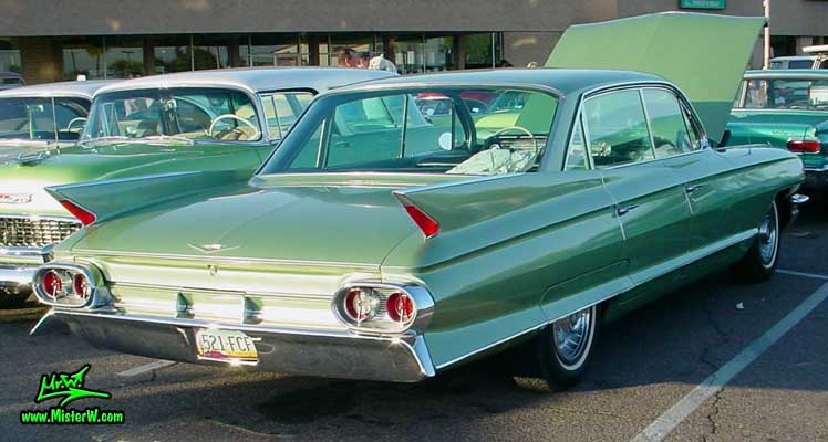Photo of a green 1961 Cadillac 4 Door Hardtop Sedan at a classic car meeting in Phoenix, Arizona. 1961 Cadillac Sedan