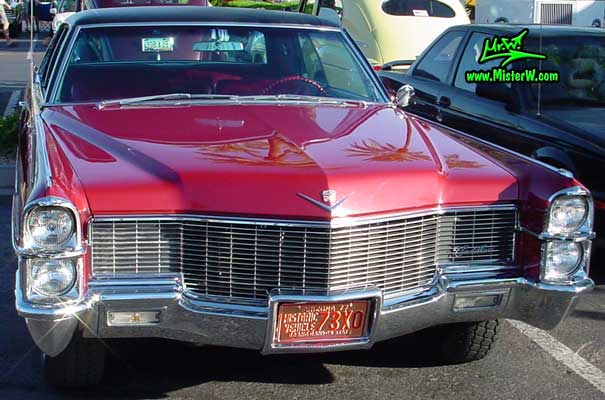 Photo of a dark red 1965 Cadillac 2 Door Hardtop Coupe at the Scottsdale Pavilions Classic Car Show in Arizona. 1965 Caddy