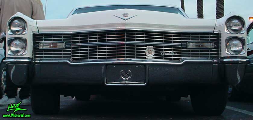 Photo of a white 1966 Cadillac 2 Door Hardtop Coupe at the Scottsdale Pavilions Classic Car Show in Arizona. 1966 Cadillac Chrome Grill