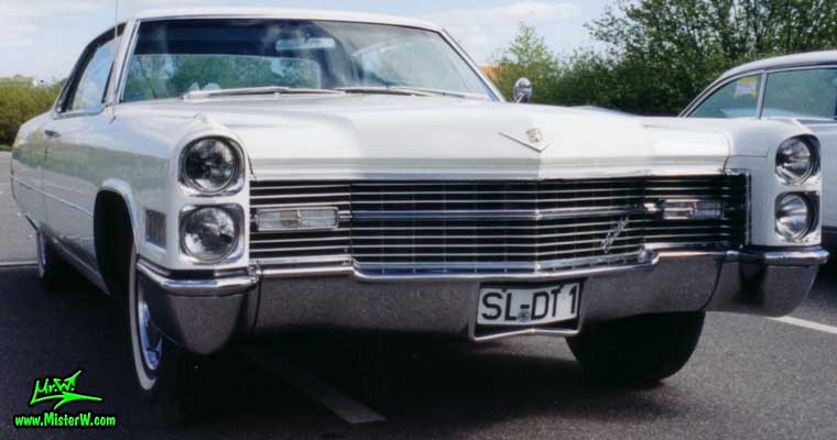 Photo of a white 1966 Cadillac 2 Door Hardtop Coupe at a classic car meeting in Germany. White 1966 Cadillac Coupe