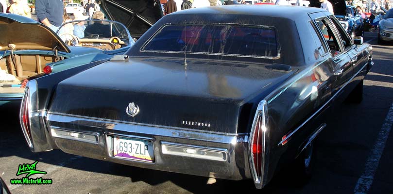 Photo of a black 1971 Cadillac Fleetwood Series 75 4 door limousine at the Scottsdale Pavilions Classic Car Show in Arizona. Side view of a 1971 Cadillac Fleetwood Series 75 limousine