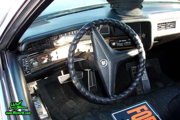Photo of a black 1971 Cadillac Fleetwood Series 75 4 door limousine at the Scottsdale Pavilions Classic Car Show in Arizona. Dashboard & speedometer of a 1971 Cadillac Fleetwood Series 75 limousine