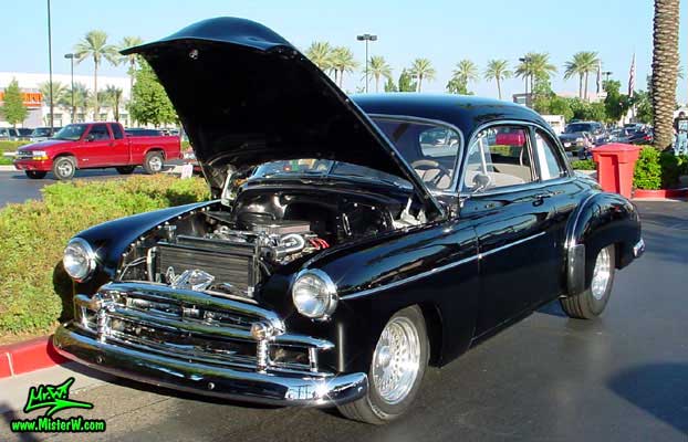 Photo of a black 1950 Chevrolet 2 Door Hardtop Coupe at the Scottsdale Pavilions Classic Car Show in Arizona. 1950 Chevy