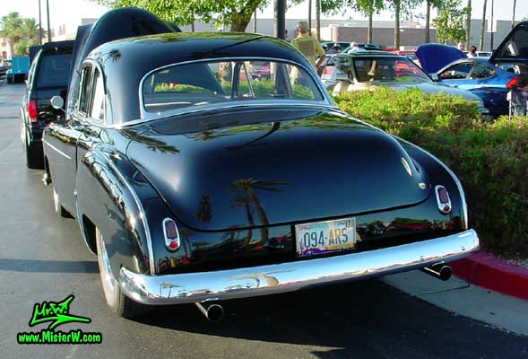 Photo of a black 1950 Chevrolet 2 Door Hardtop Coupe at the Scottsdale Pavilions Classic Car Show in Arizona. 1950 Chevy Coupe