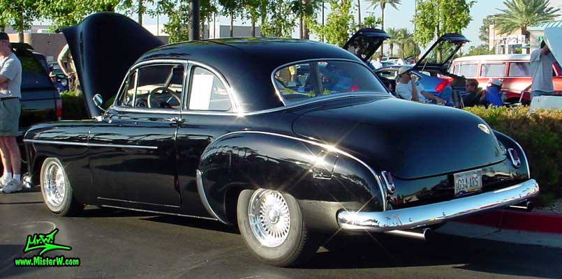 Photo of a black 1950 Chevrolet 2 Door Hardtop Coupe at the Scottsdale Pavilions Classic Car Show in Arizona. 1950 Chevrolet Coupe
