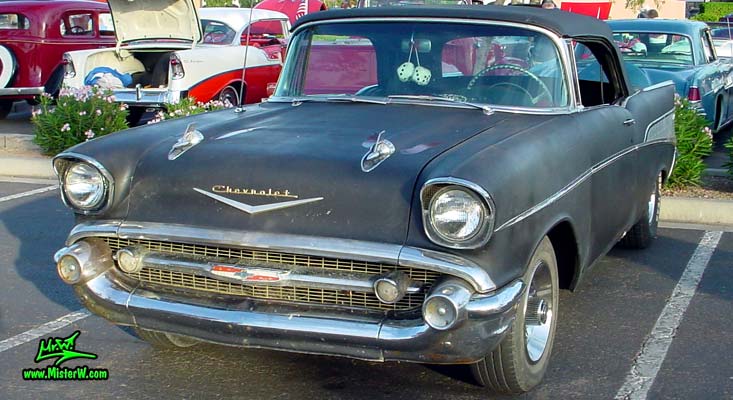 Photo of a flat black 1957 Chevrolet Bel Air Convertible at the Scottsdale Pavilions Classic Car Show in Arizona. Frontview of a Flat Black 57 Chevrolet Bel Air Convertible